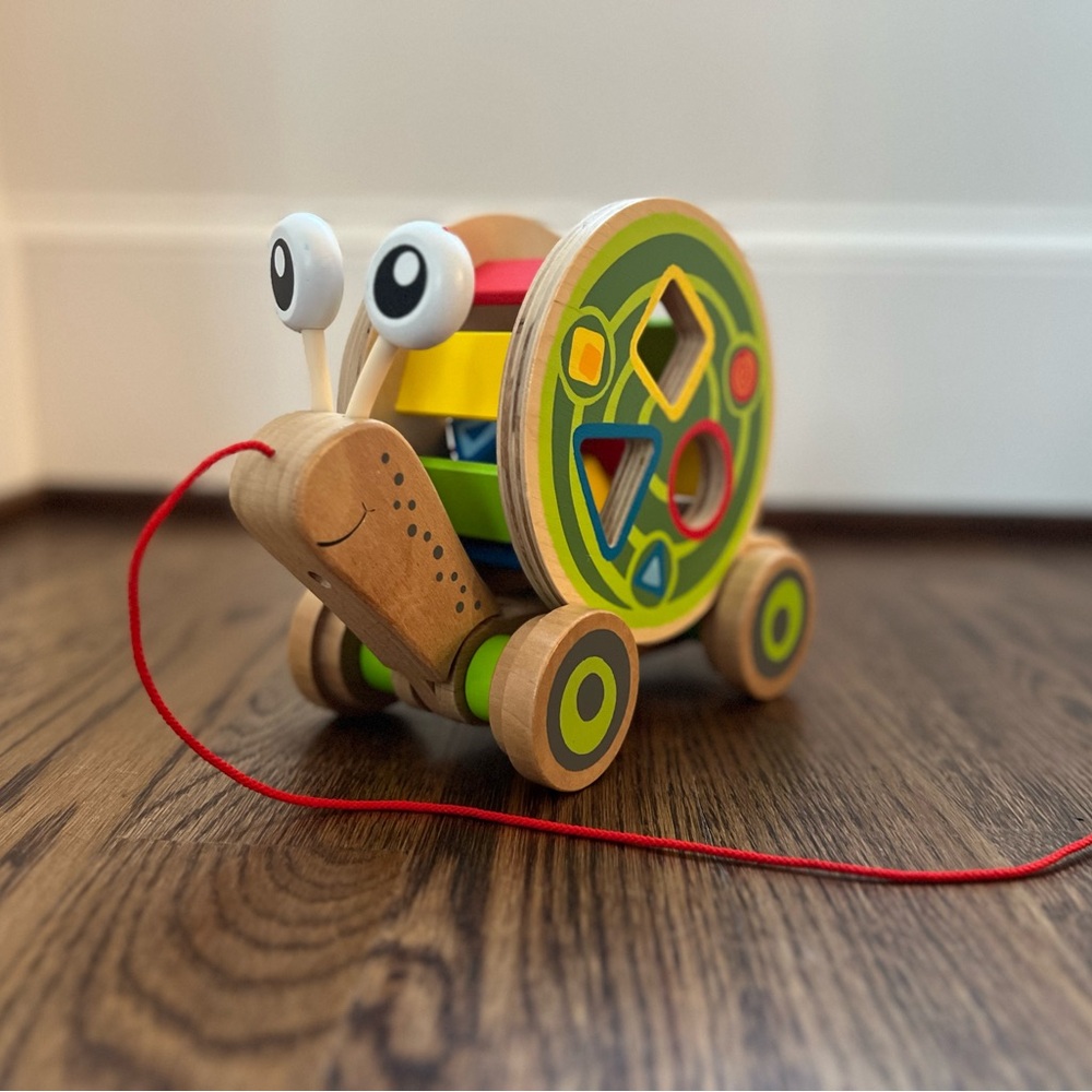 Hape Walk-A-Long Snail Pull Toy with Shape Sorter